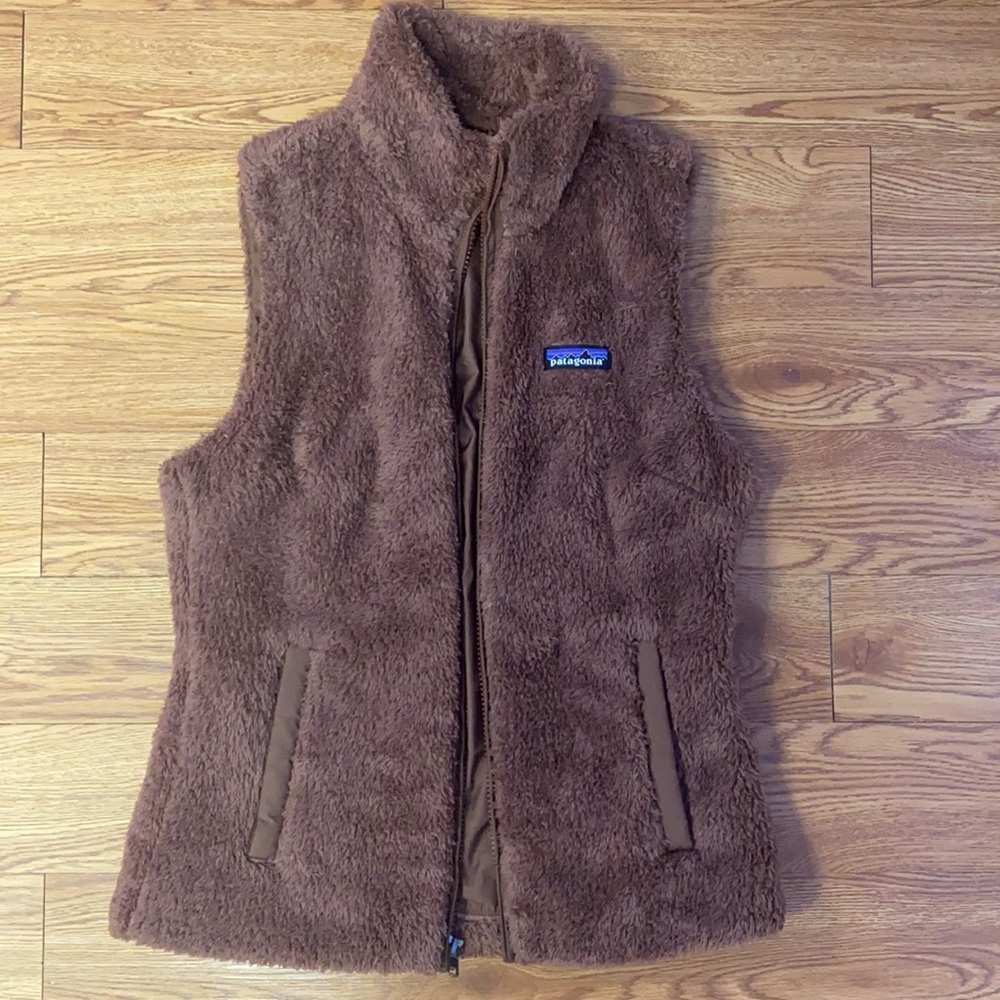 Woman’s brown Patagonia Sherpa vest.